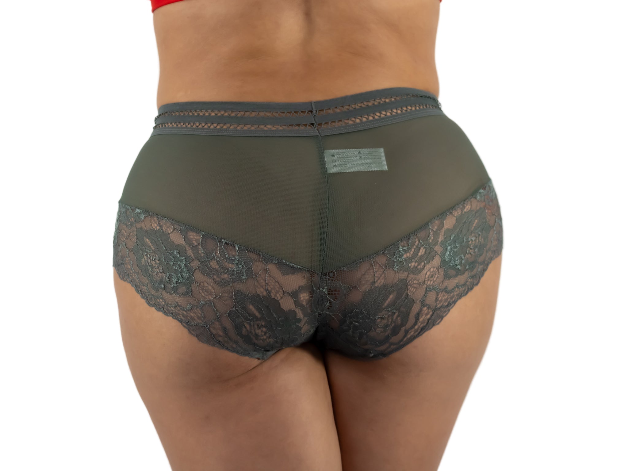 Green lace underwear on a plain background