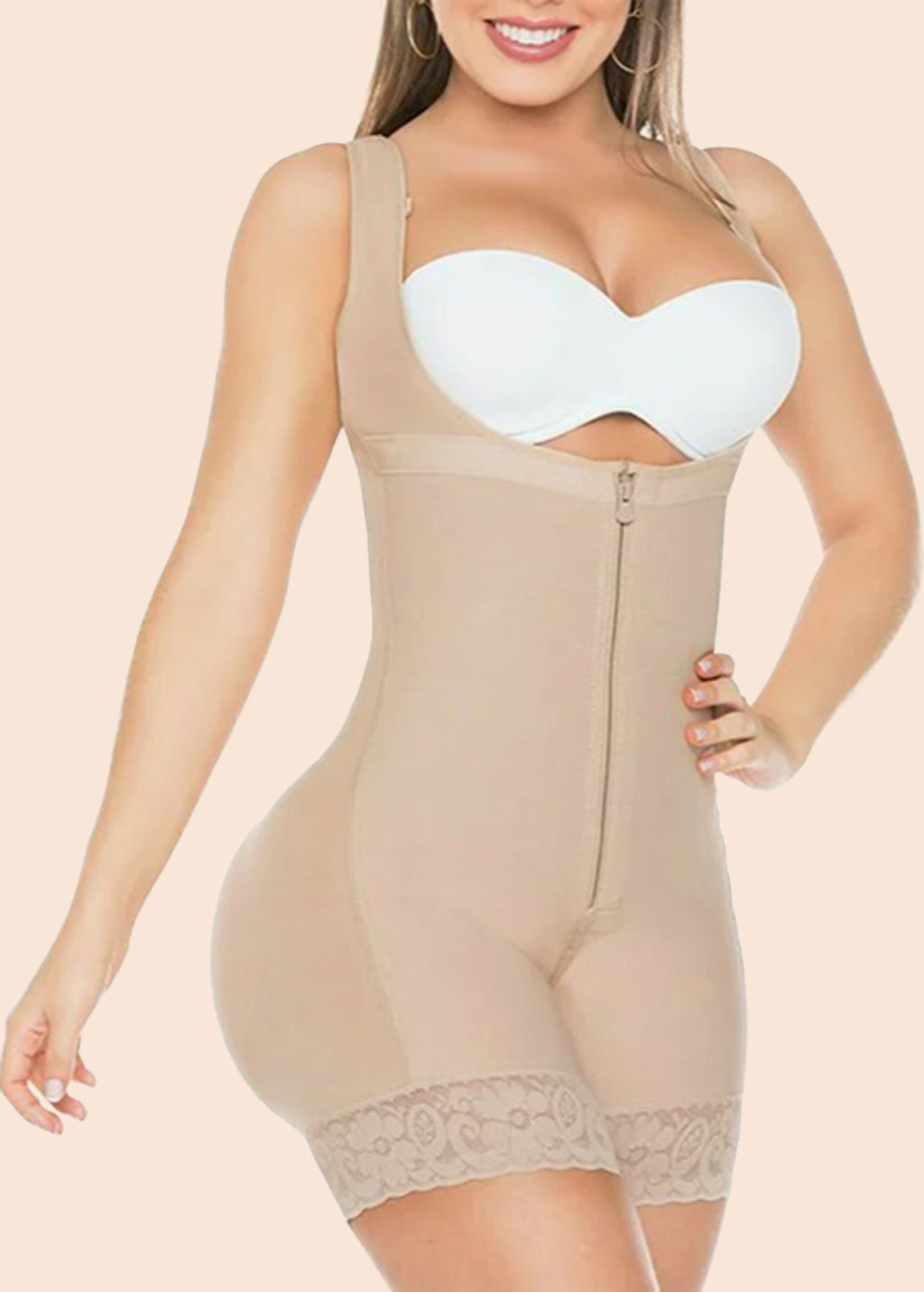 Woman wearing a beige shapewear bodysuit on a beige background