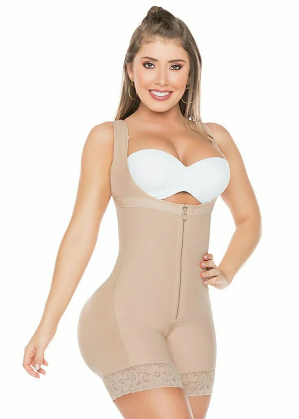 Woman wearing a beige shapewear bodysuit on a white background