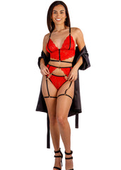 Woman wearing a red lingerie set with black strappy details on a white background