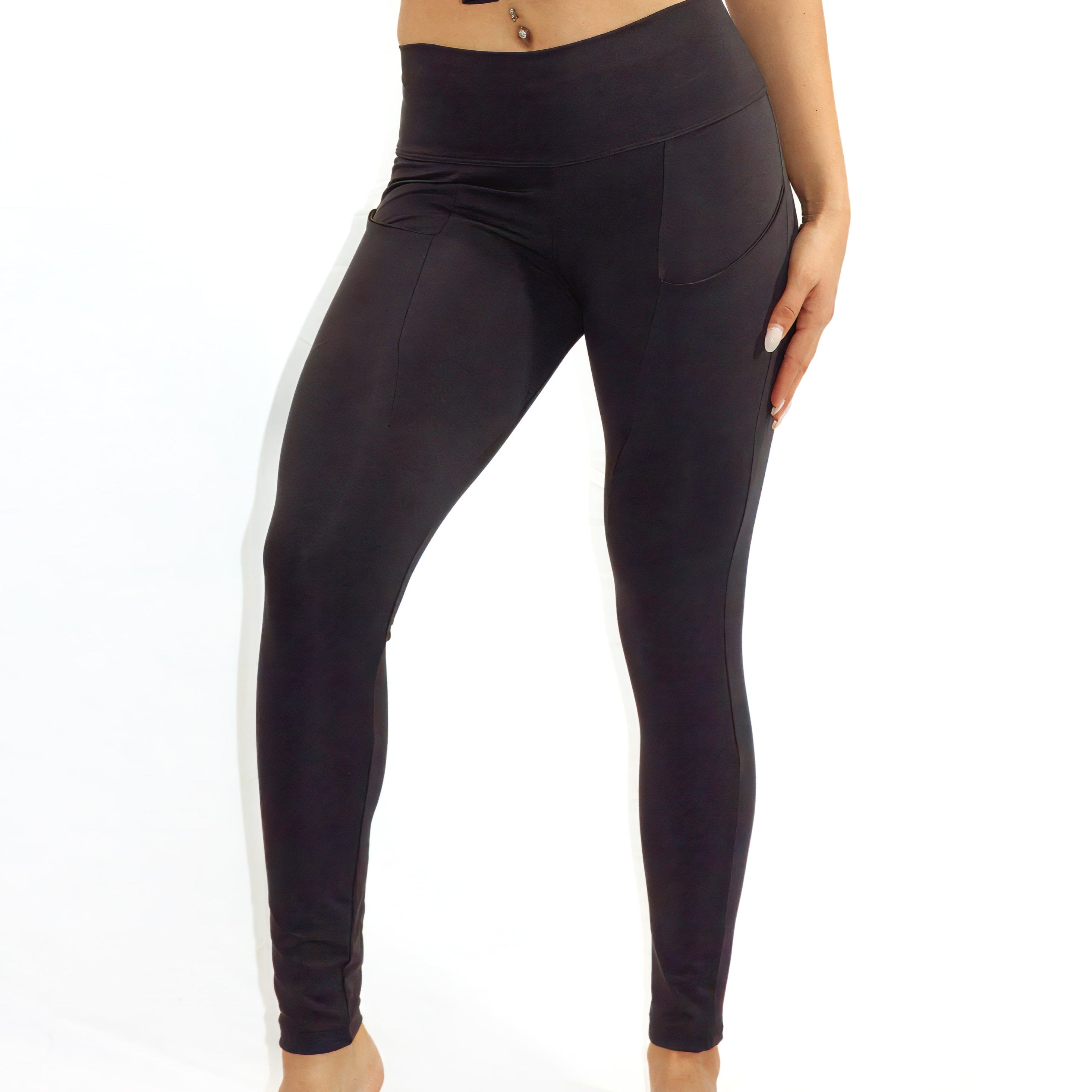 Arysti black high waisted leggings with side pockets and slimming tummy control.