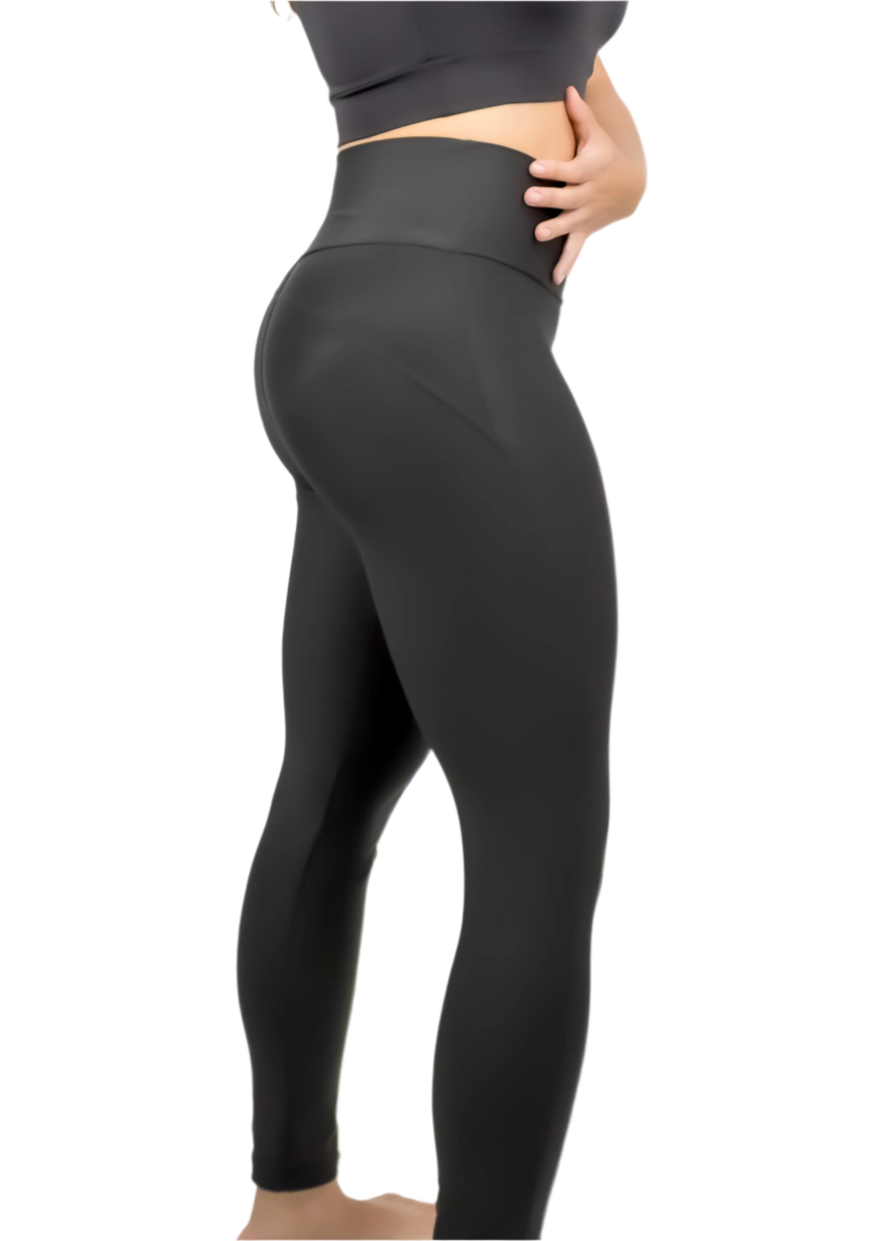 Person wearing black leggings on a white background