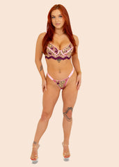 woman wearing a pink floral lingerie set
