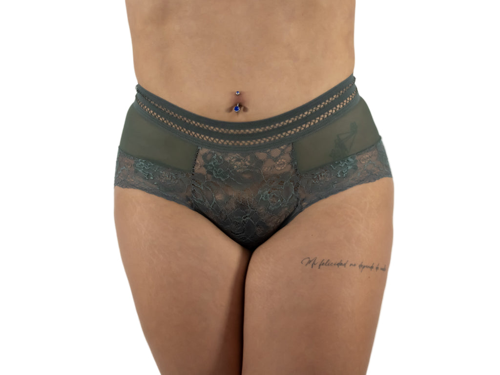 Green lace underwear worn by a person on a white background