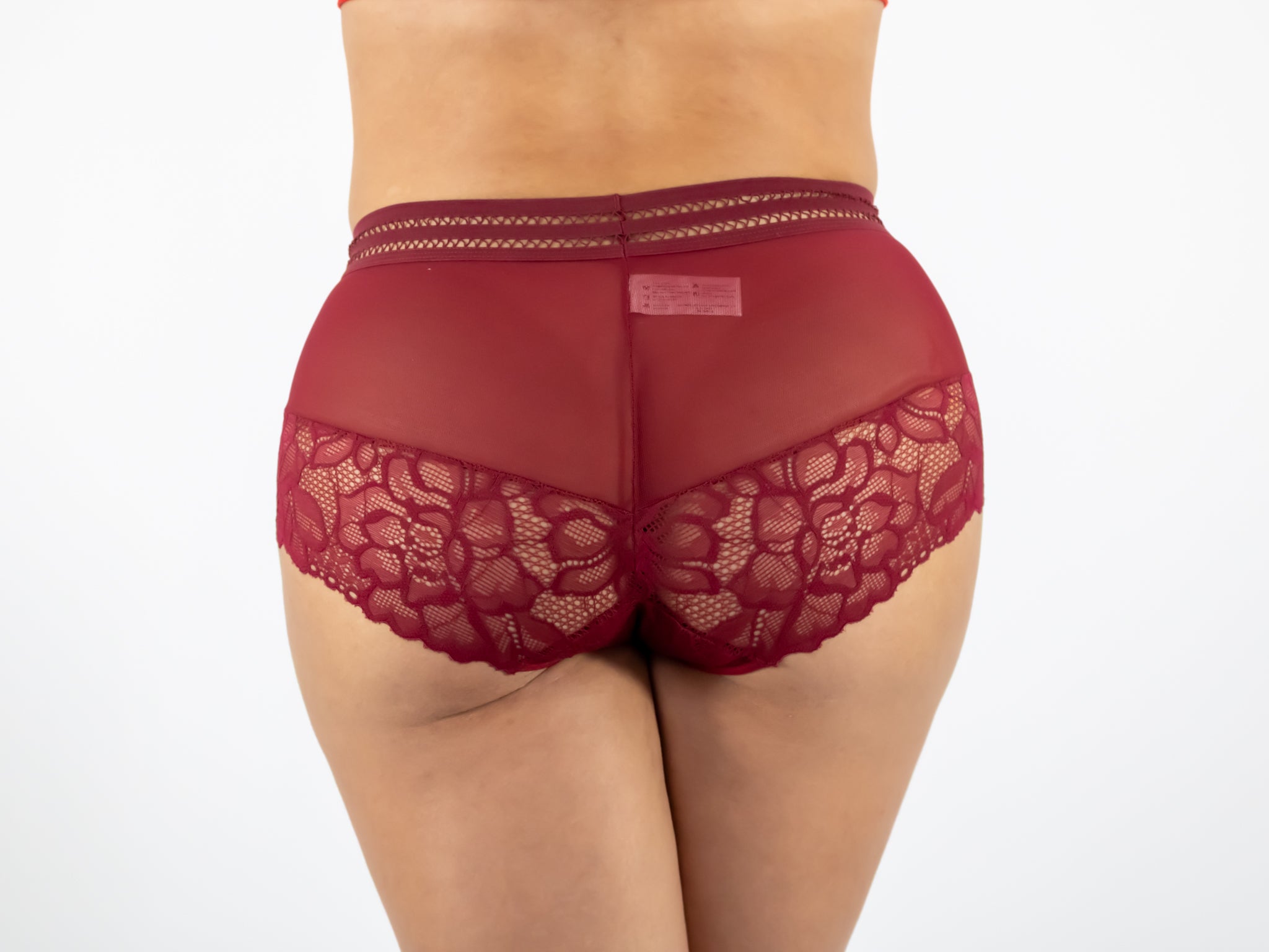 Red lace underwear on a white background