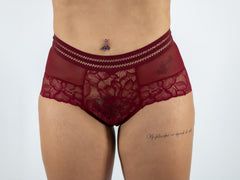 Red lace underwear on a plain background
