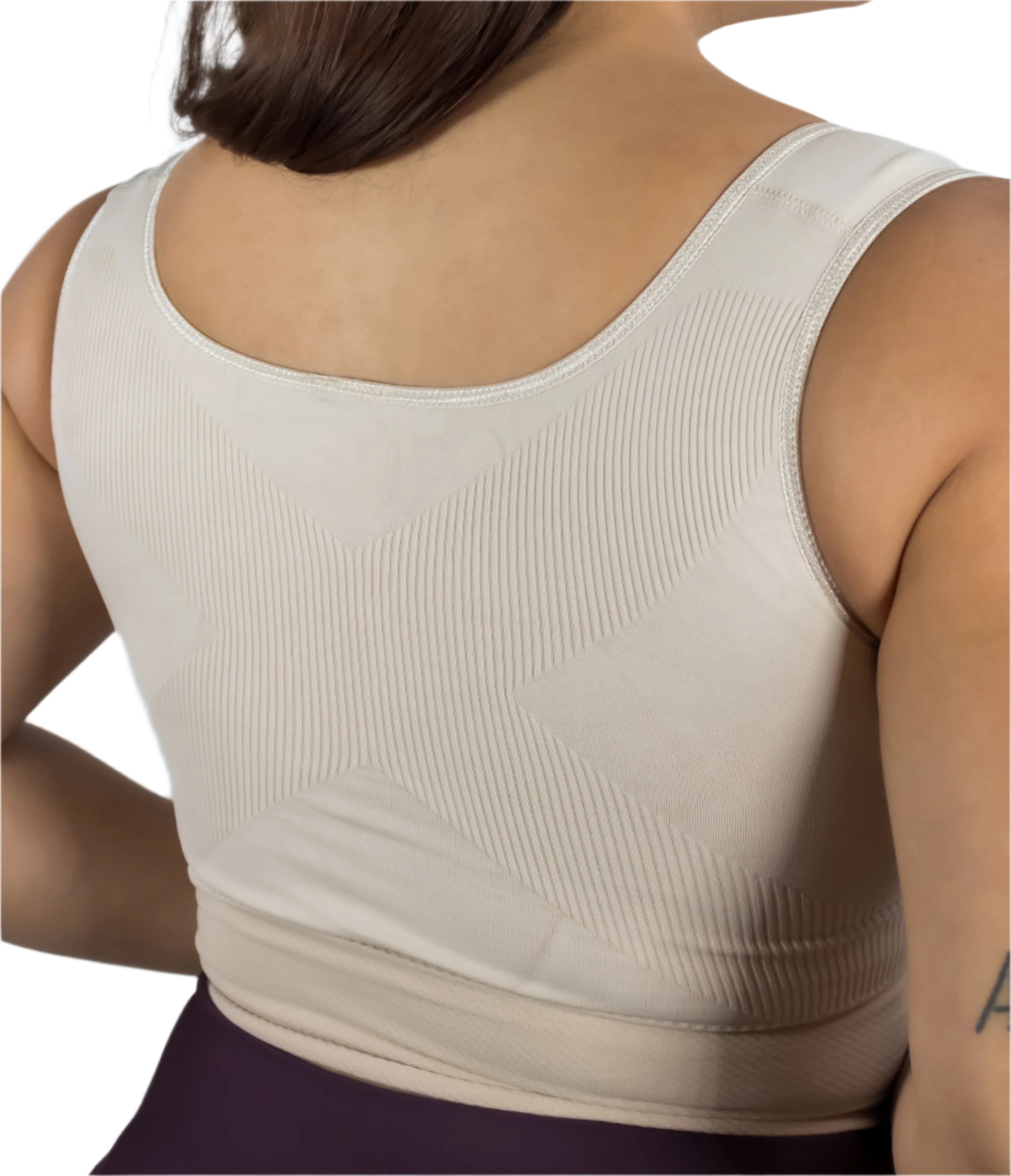 Beige tank top worn by a person against a light blue background