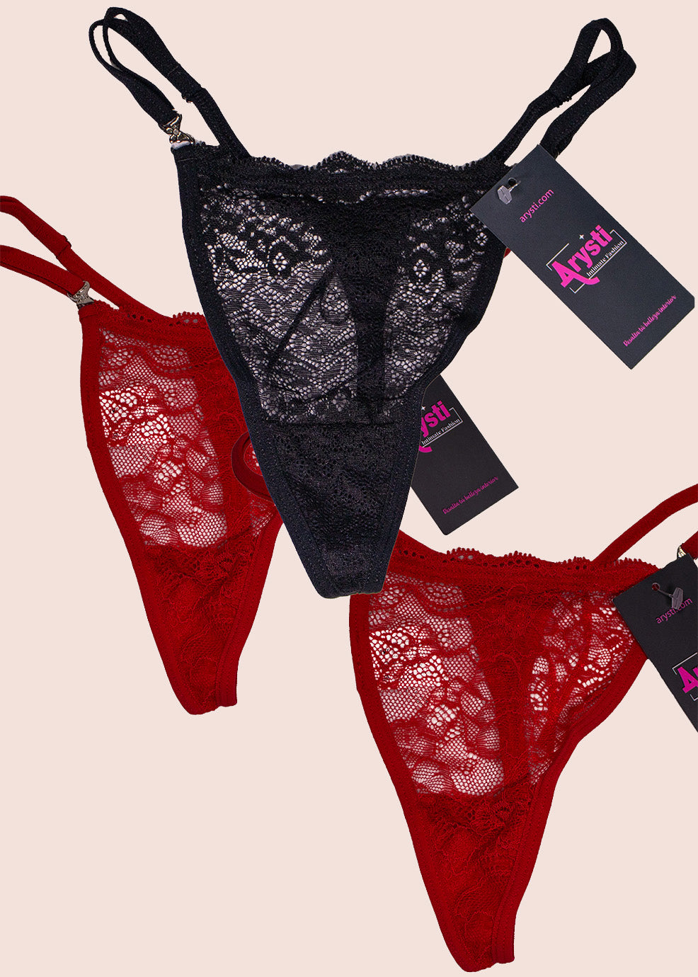 Black and red lace lingerie set with tags on a beige background