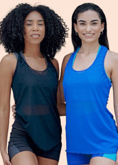 Two women wearing athletic tank tops and shorts on a peach background