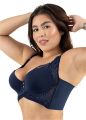 Woman wearing a navy blue bra with lace details on a white background