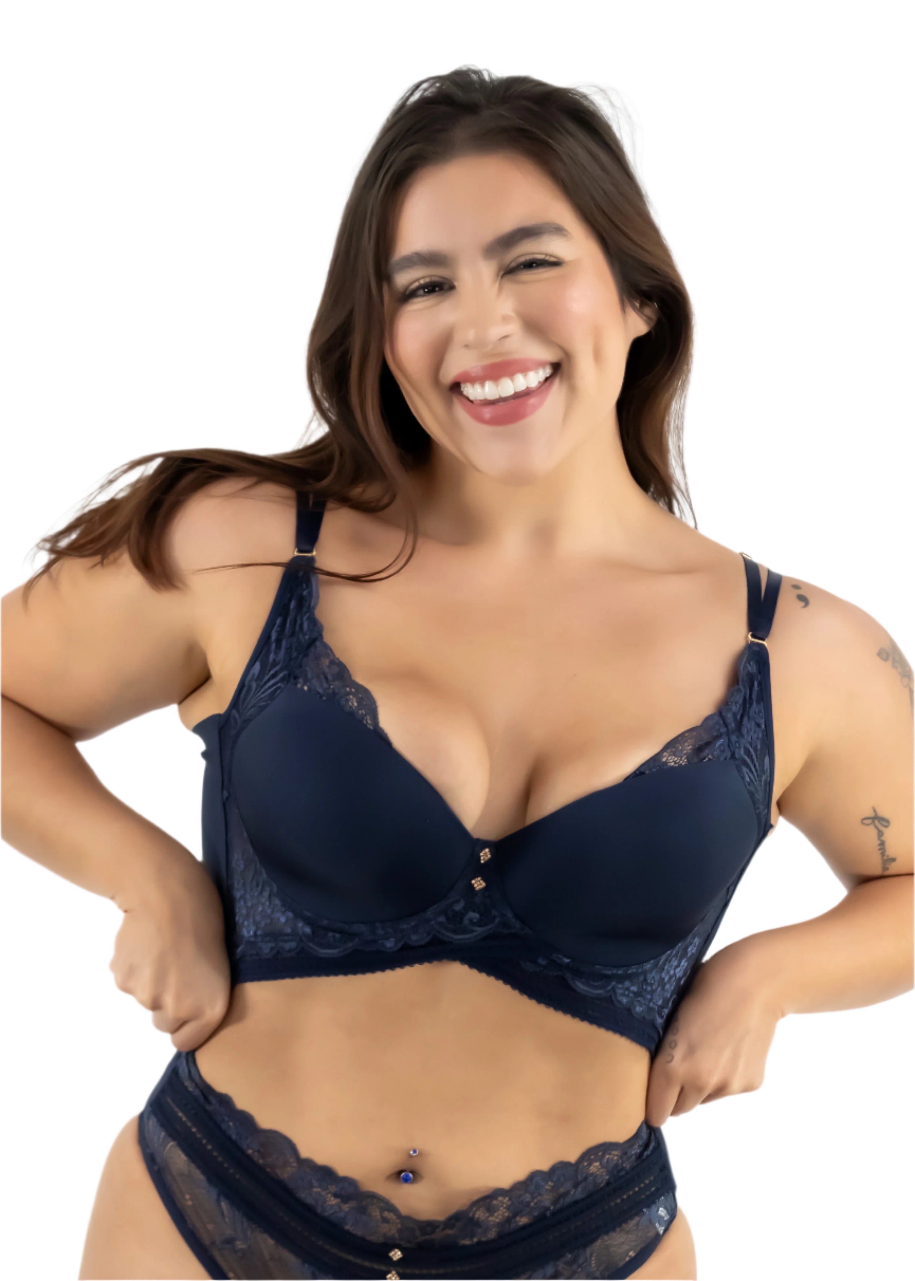 Woman wearing a navy blue lace bra and panties set on a white background