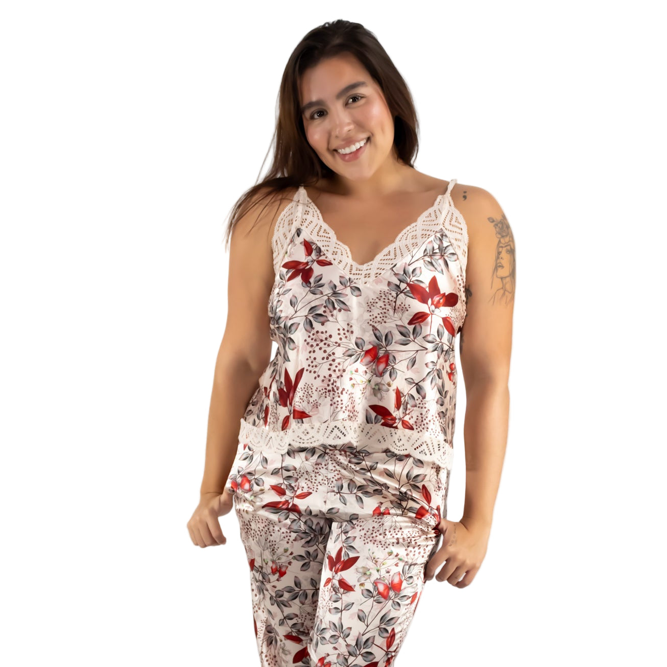 Woman wearing a floral pajama set on a white background