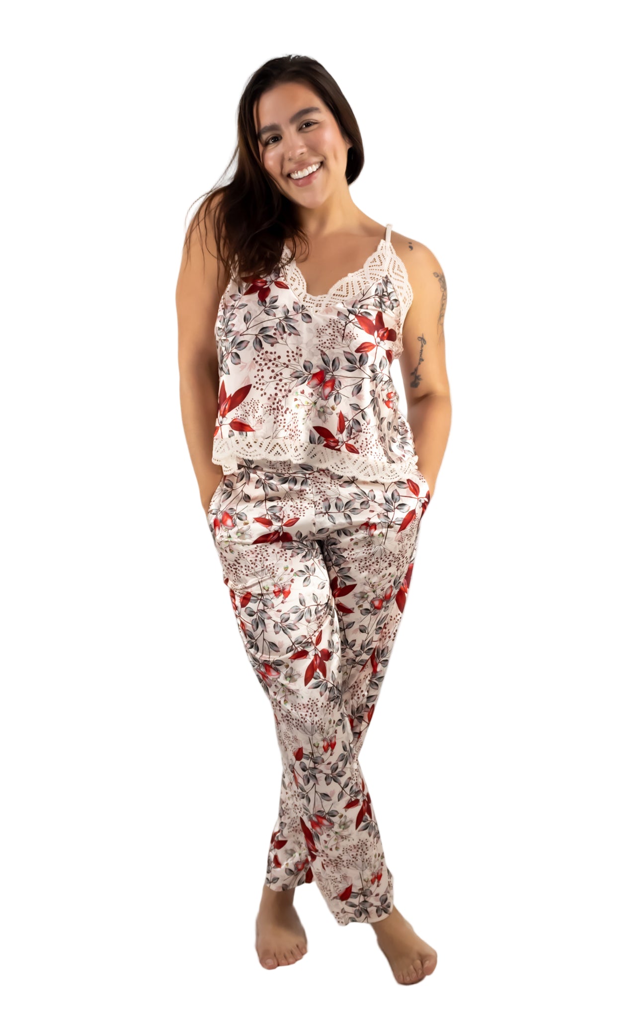 Woman wearing a floral pajama set on a white background
