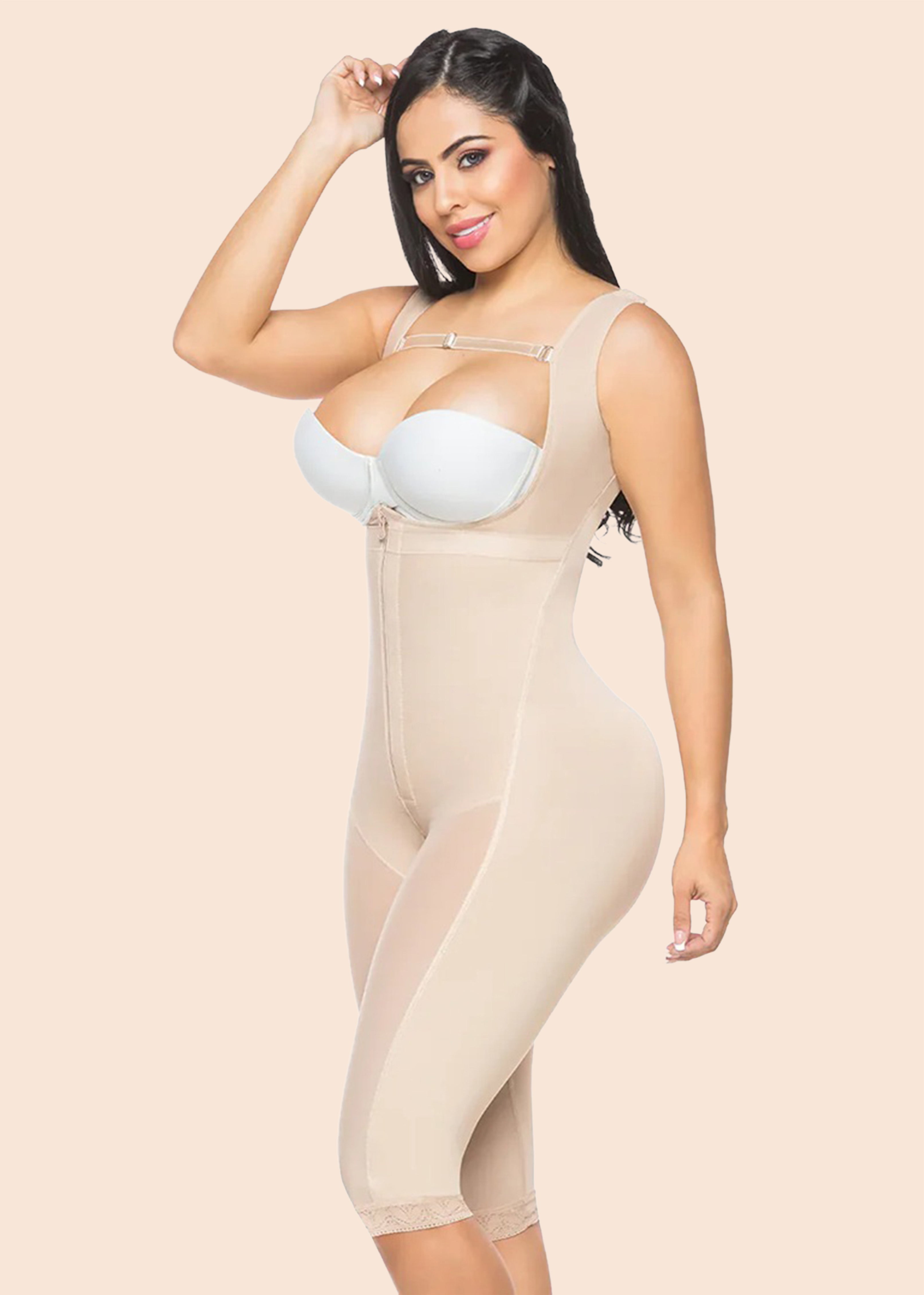 Woman wearing a beige shapewear garment on a beige background