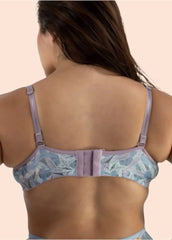 Woman wearing a floral bralette on a beige background