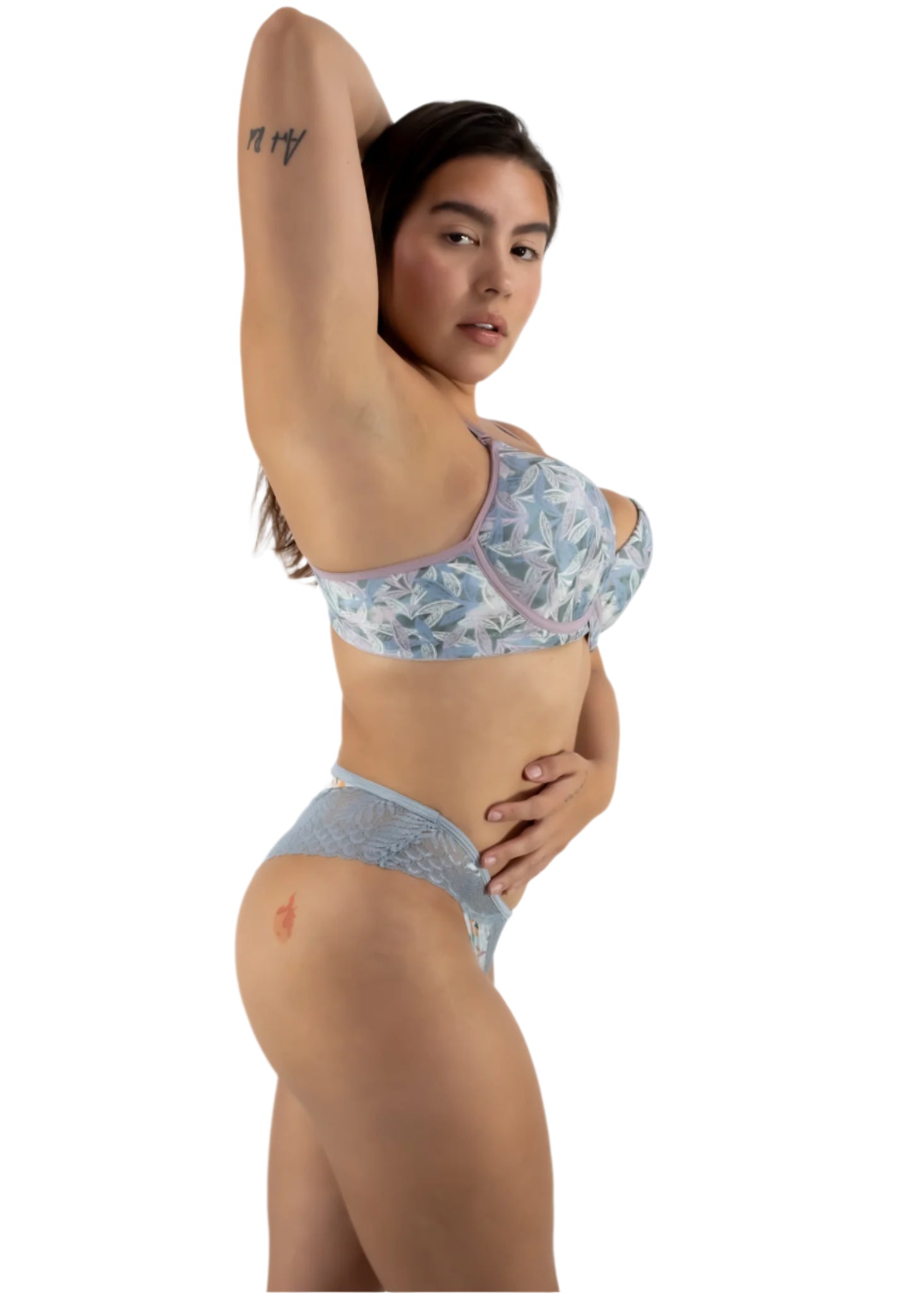 Woman wearing a floral bikini set on a white background