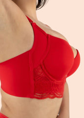 Red bra with mesh detailing on a beige background