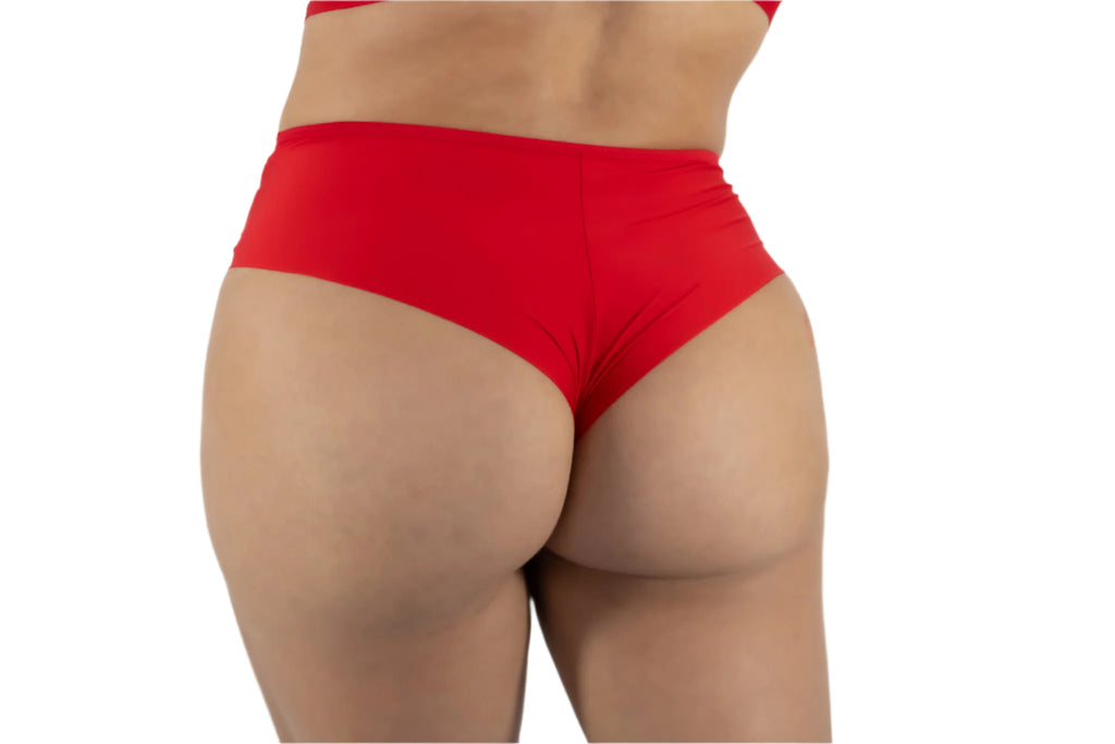 Red underwear worn by a person on a plain background