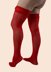 Red tights worn by a person on a beige background
