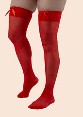 Red knee-high socks with bows on a beige background