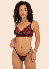 woman wearing a floral red and black lingerie set