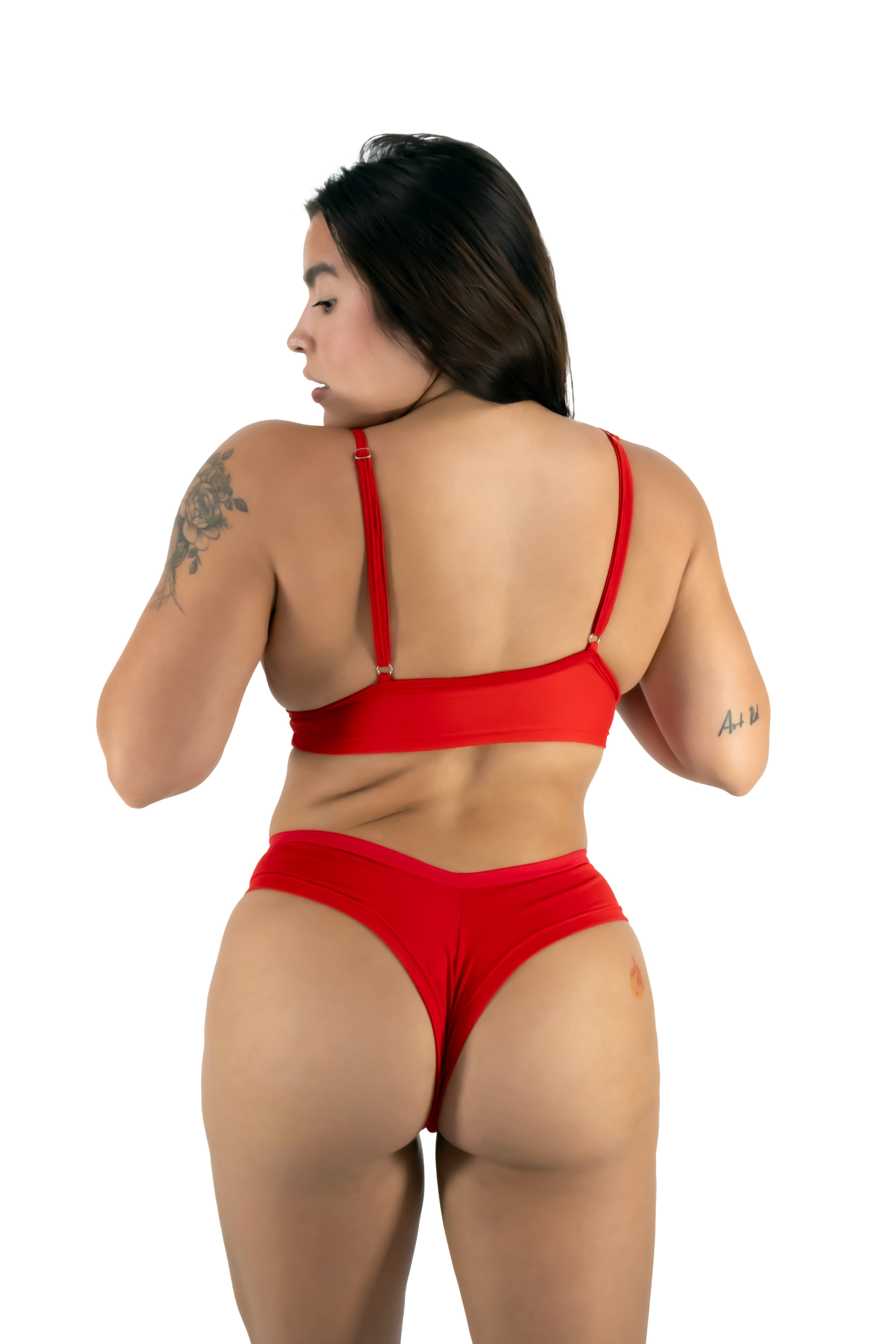 Woman wearing a red bikini on a white background