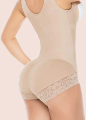 Beige shapewear with lace trim on a plain background