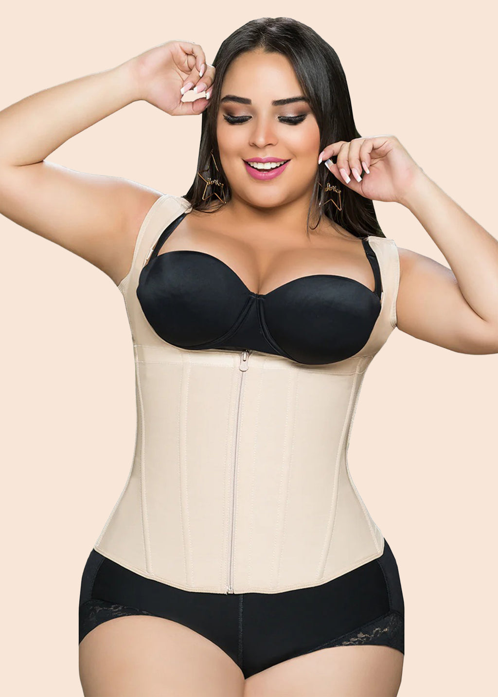 Woman wearing a beige waist trainer over a black bra and panties on a beige background