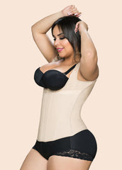 Woman wearing a black and beige shapewear garment on a beige background