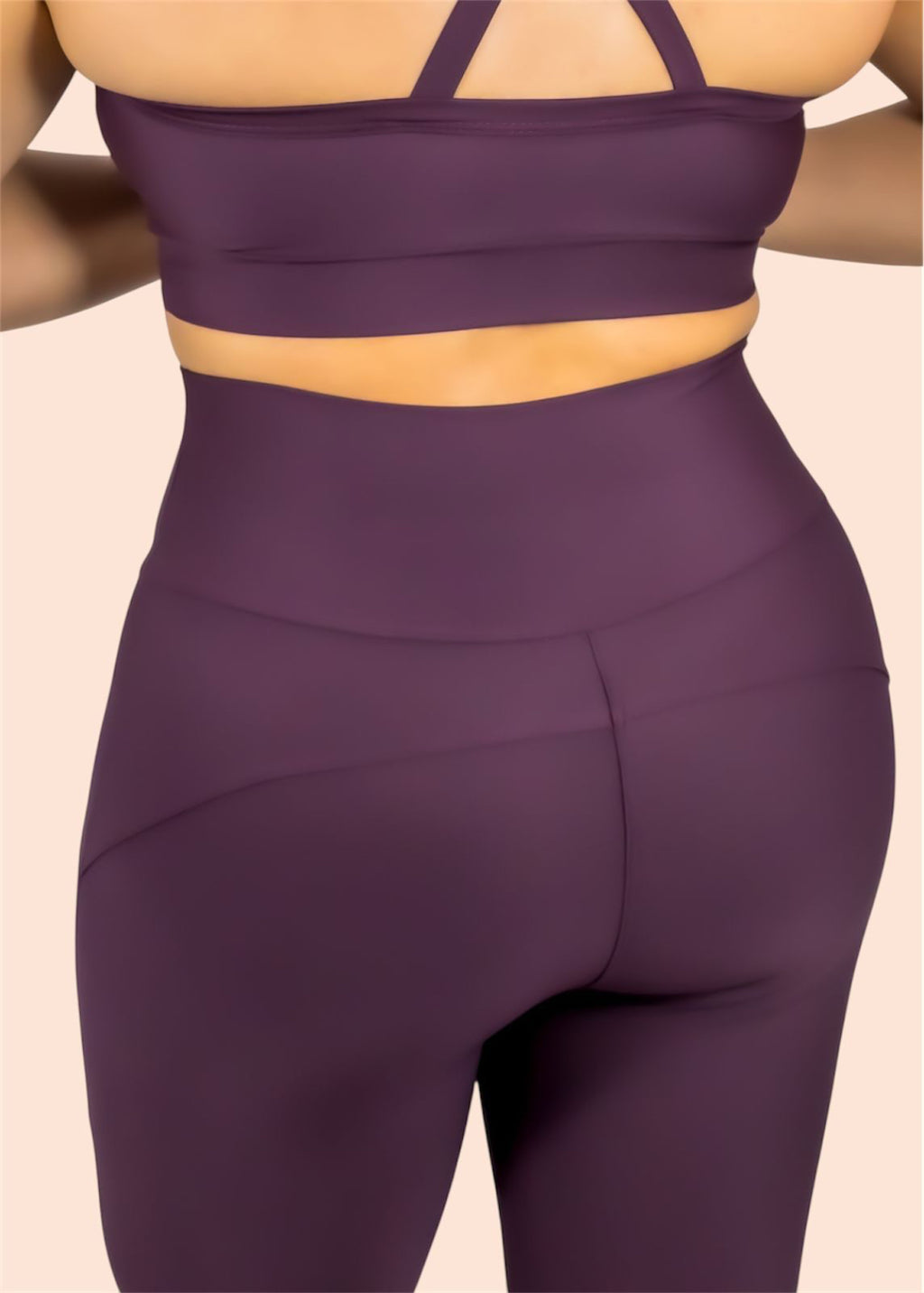 Purple athletic outfit on a beige background