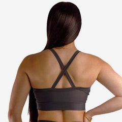 Backside of a woman wearing a grey sportswear bra with a racerback design