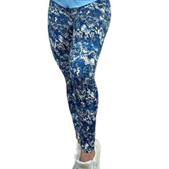 Model in high-waisted blue and white patterned activewear leggings