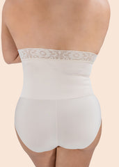 White shapewear with lace waistband on a beige background