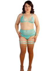 Woman wearing a turquoise lingerie set with stockings on a white background