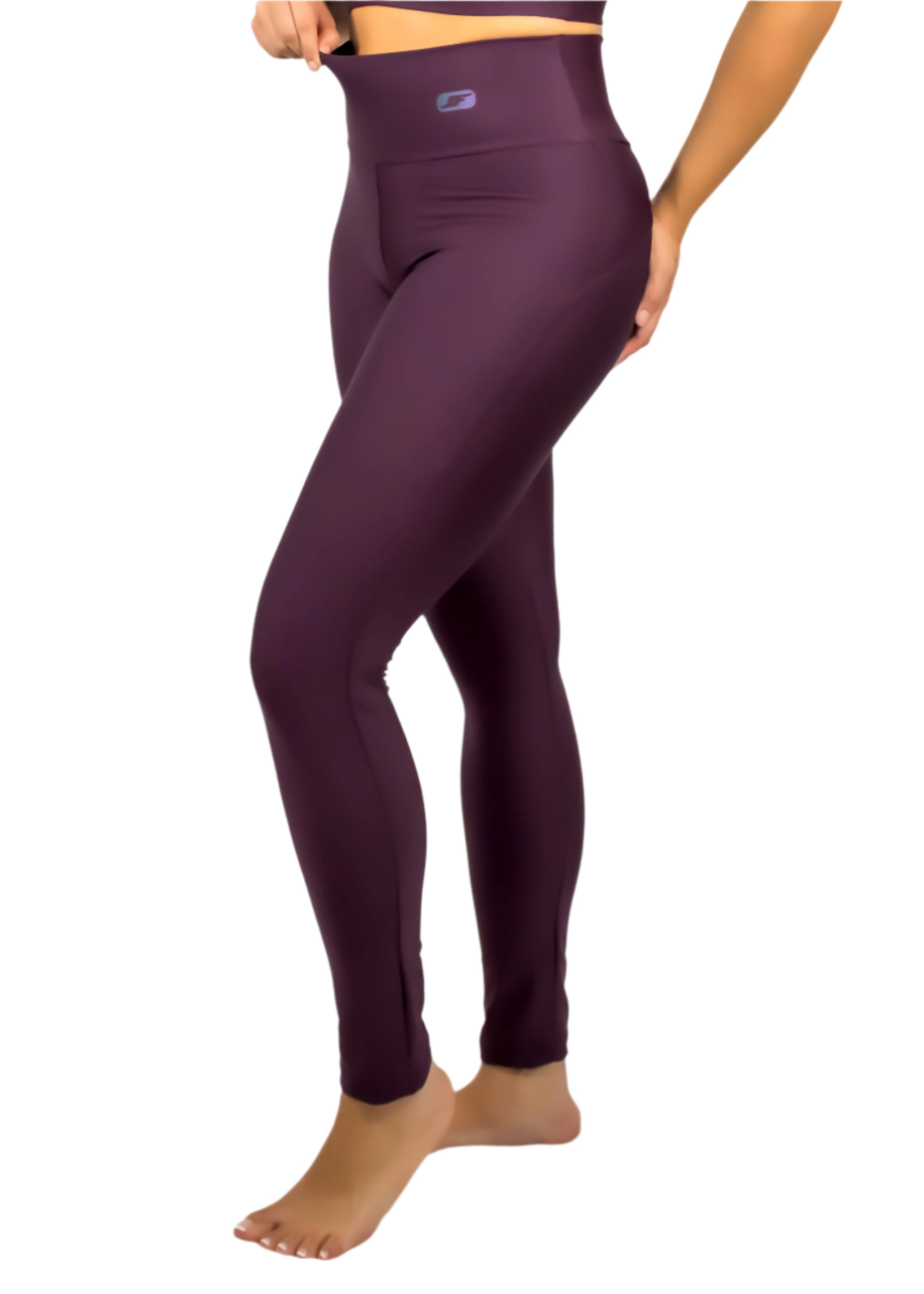 Purple leggings worn by a person on a white background
